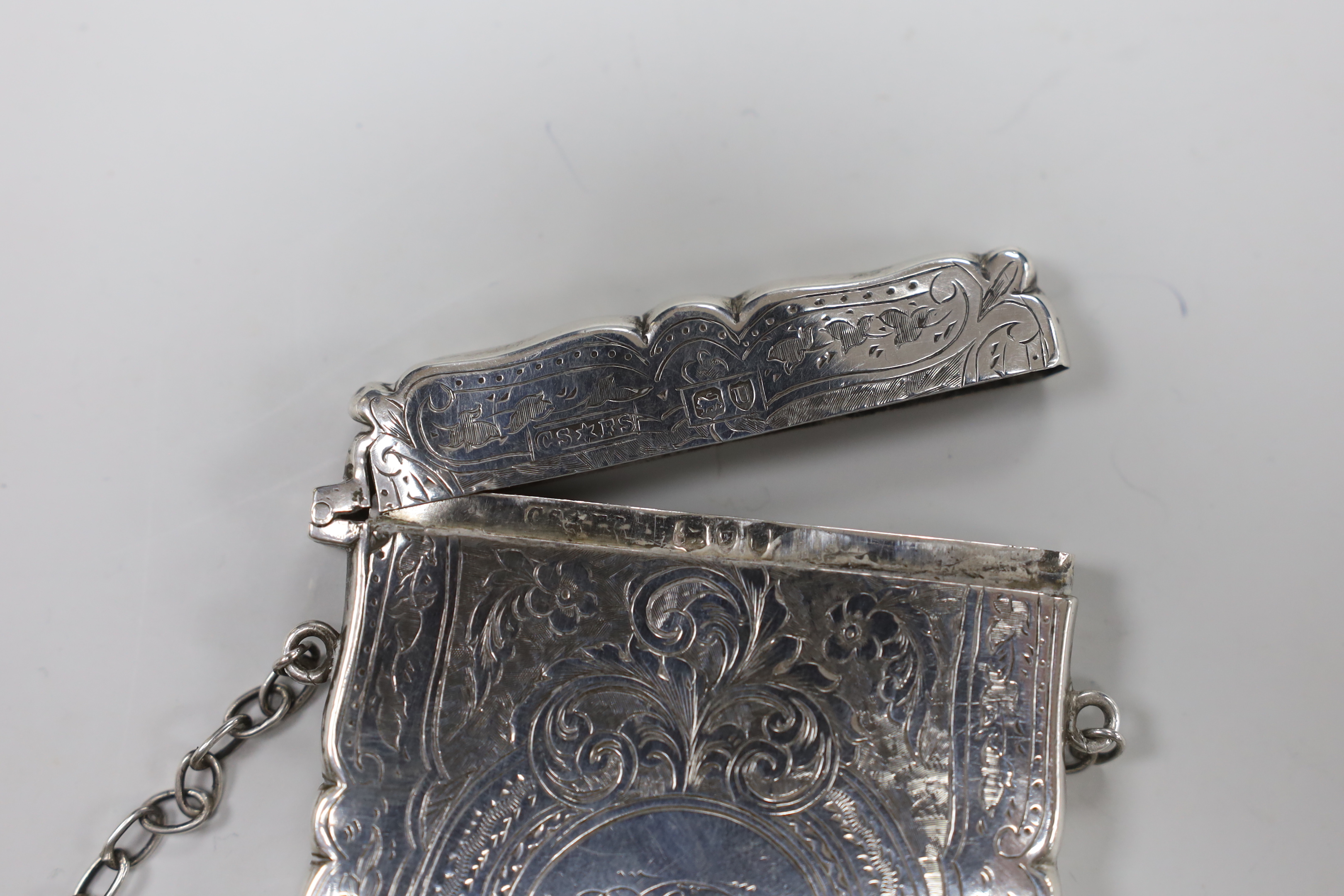 A late Victorian engraved silver card case, Saunders & Shepherd, London, 1895, 95mm.